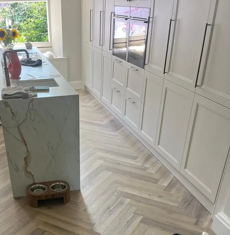 Shaker kitchen with marble island and herringbone floor fitted in East Lothian