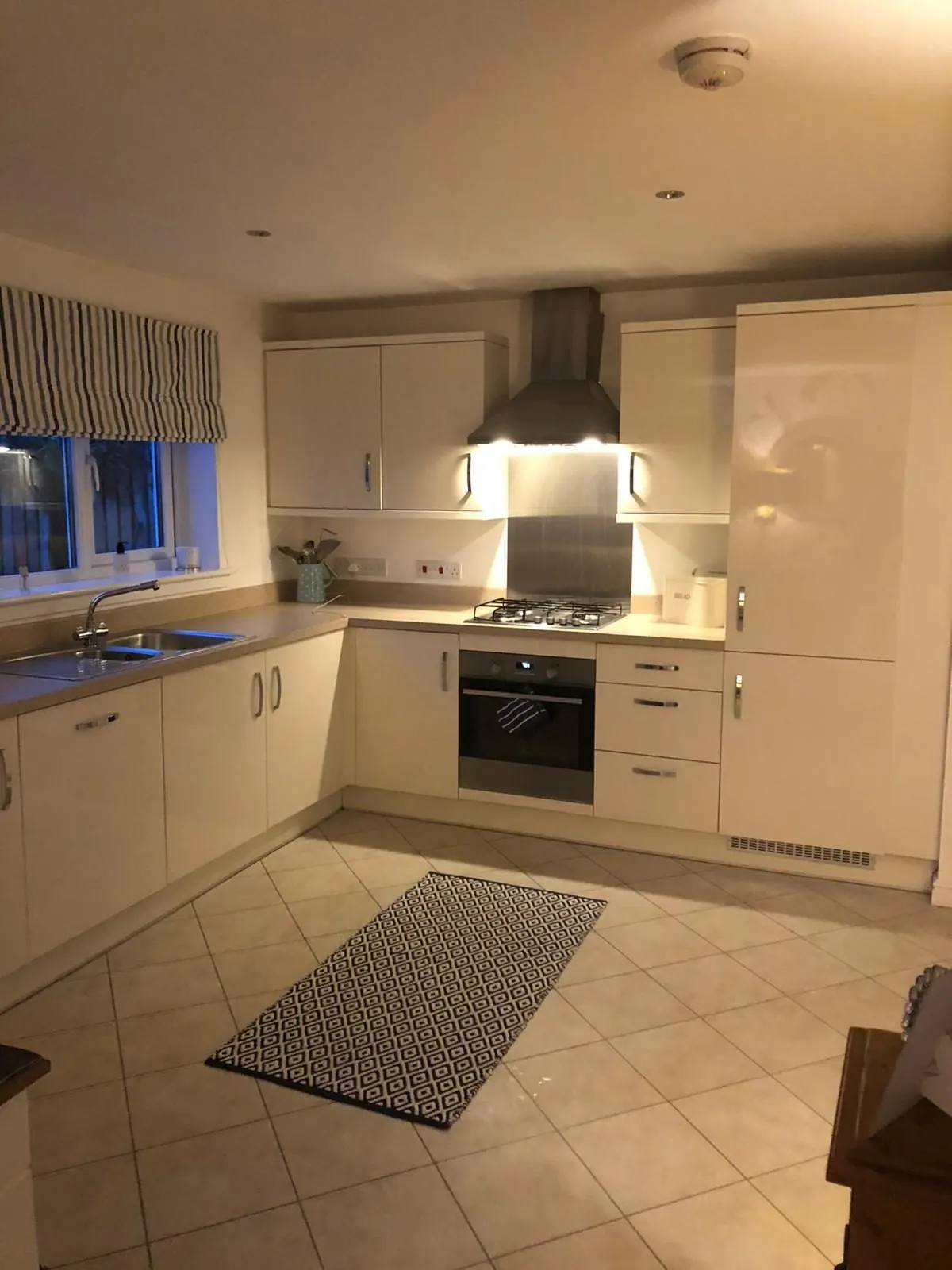Cream gloss L-shaped kitchen fitted in East Lothian