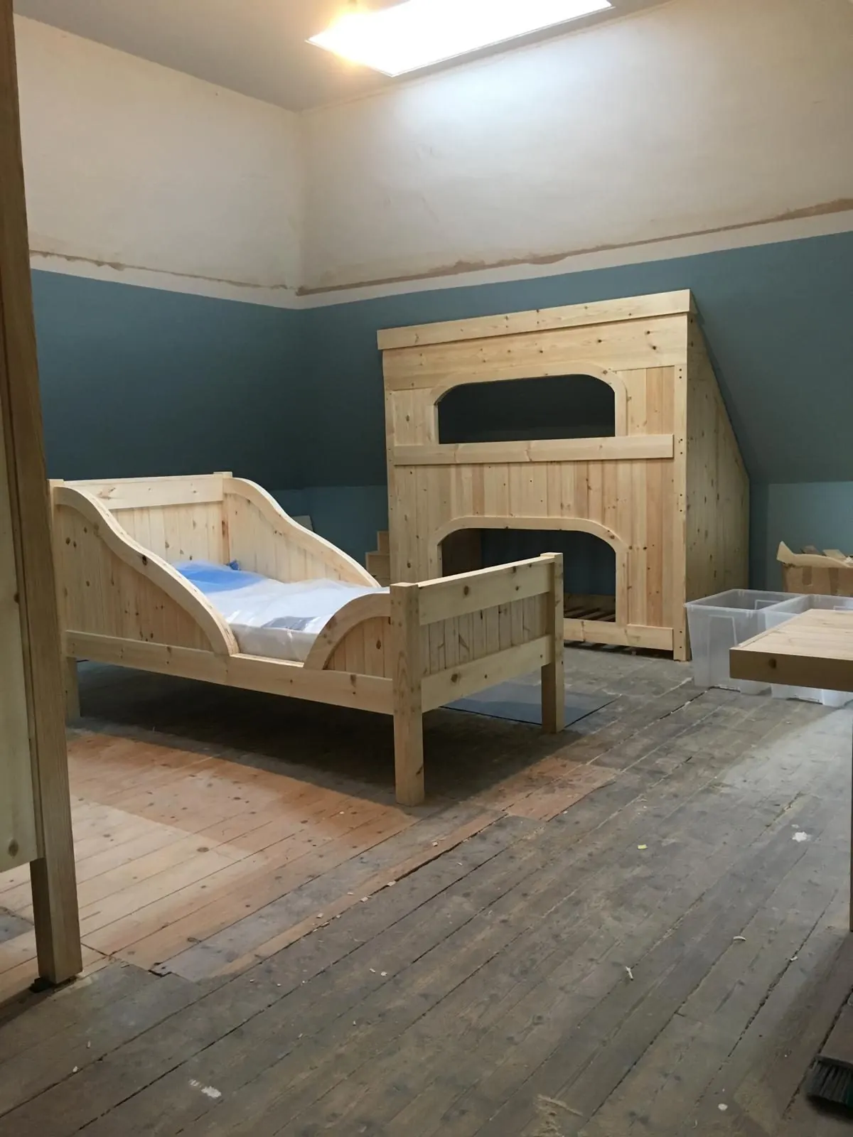 Pine sleigh bed and built-in bunk in a loft conversion in East Lothian