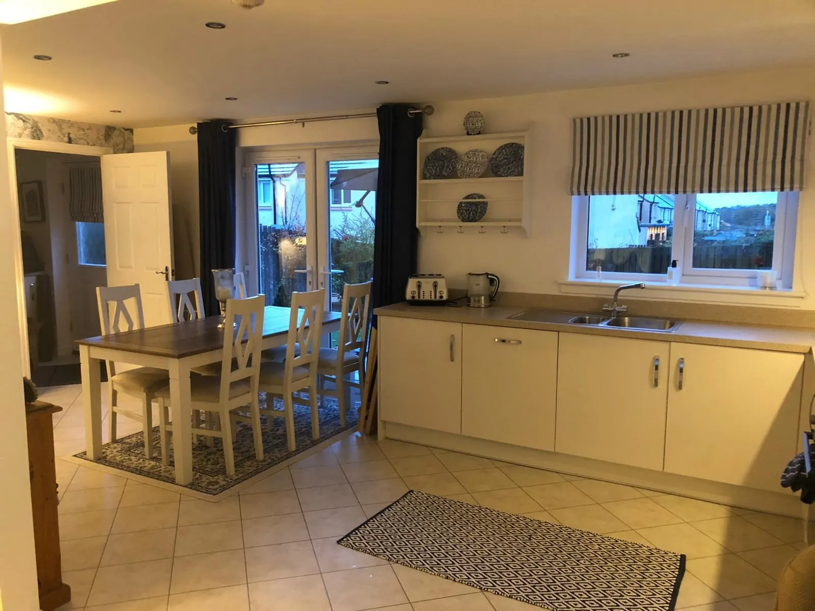 Kitchen and dining room with fitted units and patio doors